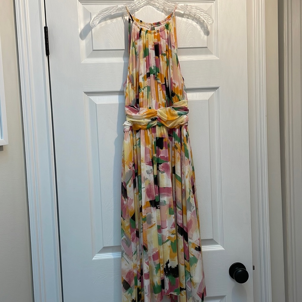 Knee length multicolored dress with handkerchief bottom. Size 4.